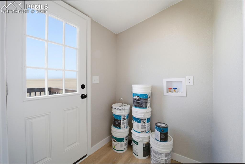35125 Book Road Yoder, CO 80864 - Photo 27 of 45 a white toilet sitting next to a bathroom sink and vanity