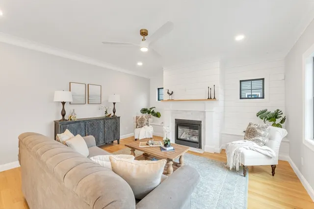 a living room with furniture and a fireplace