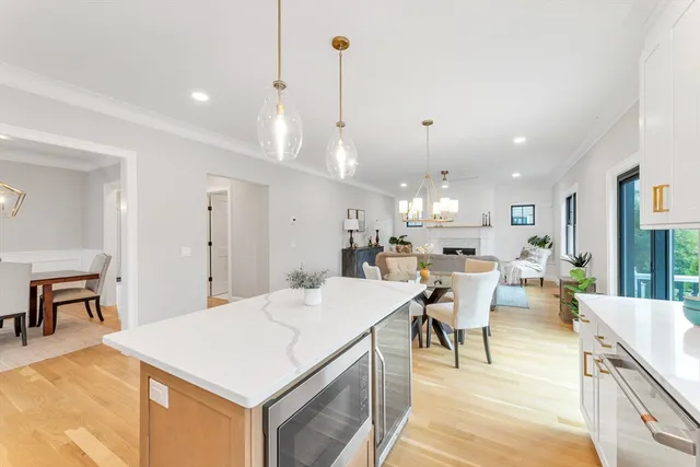 a large kitchen with a table and chairs