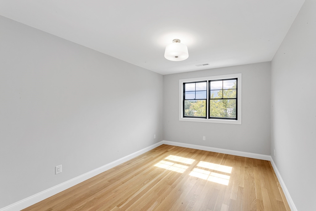 10 Starling Street Boston, MA 02132 - Photo 14 of 36 an empty room with a window