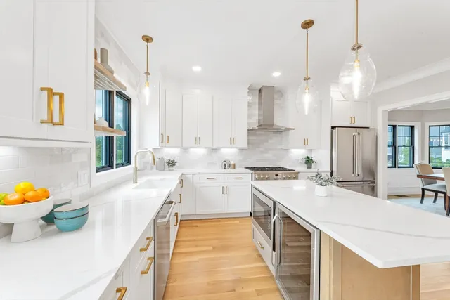 a kitchen with a sink appliances and cabinets