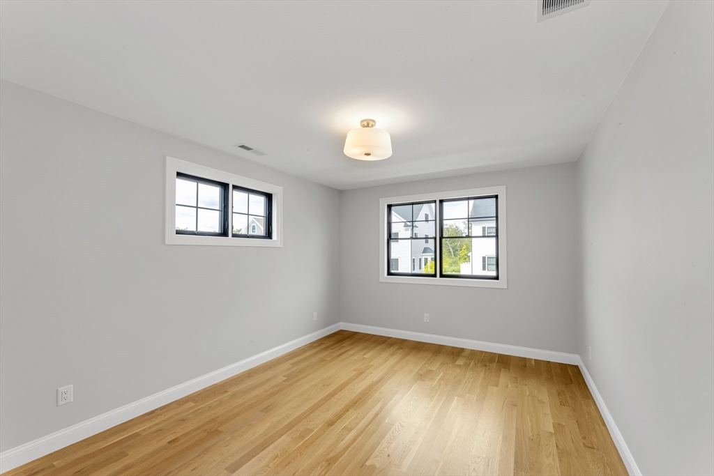 10 Starling Street Boston, MA 02132 - Photo 22 of 36 an empty room with a window