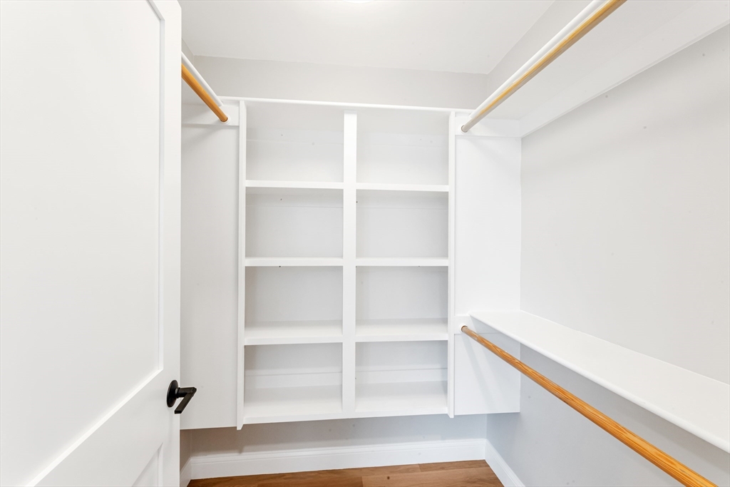 10 Starling Street Boston, MA 02132 - Photo 29 of 36 a view of walk in closet with empty racks