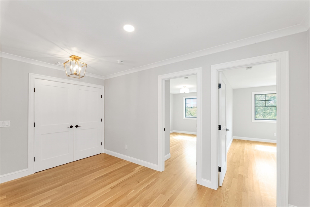 10 Starling Street Boston, MA 02132 - Photo 8 of 36 a view of empty room with wooden floor and fan