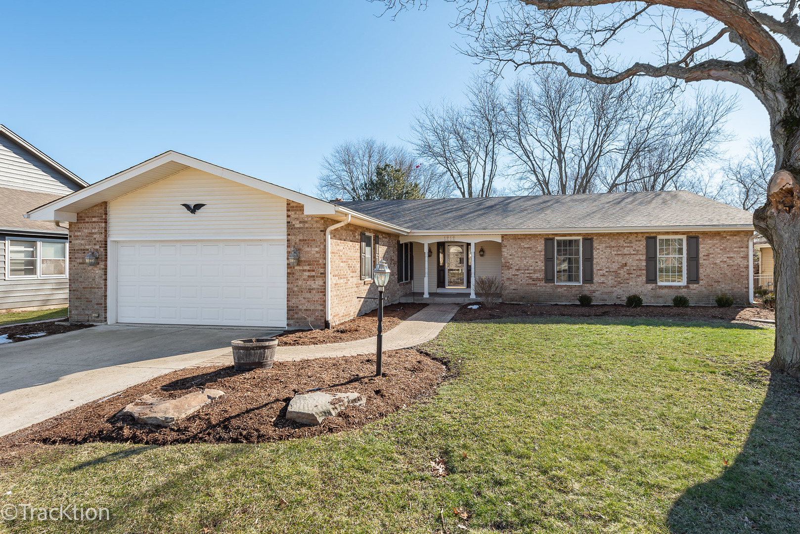 1212 Gartner Road Naperville, IL 60540 - Photo 1 of 32 a front view of a house with a yard