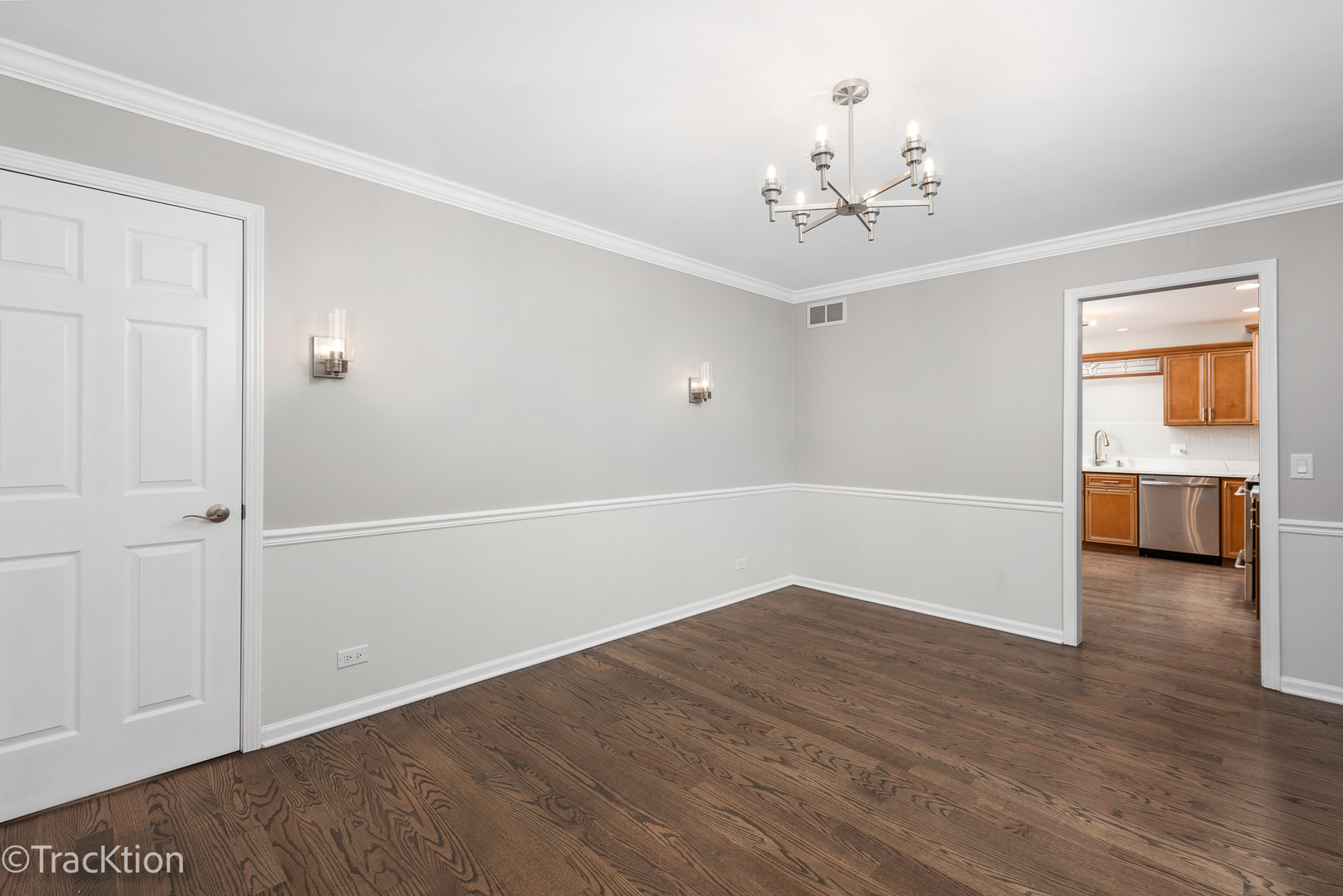 1212 Gartner Road Naperville, IL 60540 - Photo 15 of 32 an empty room with wooden floor chandelier and windows