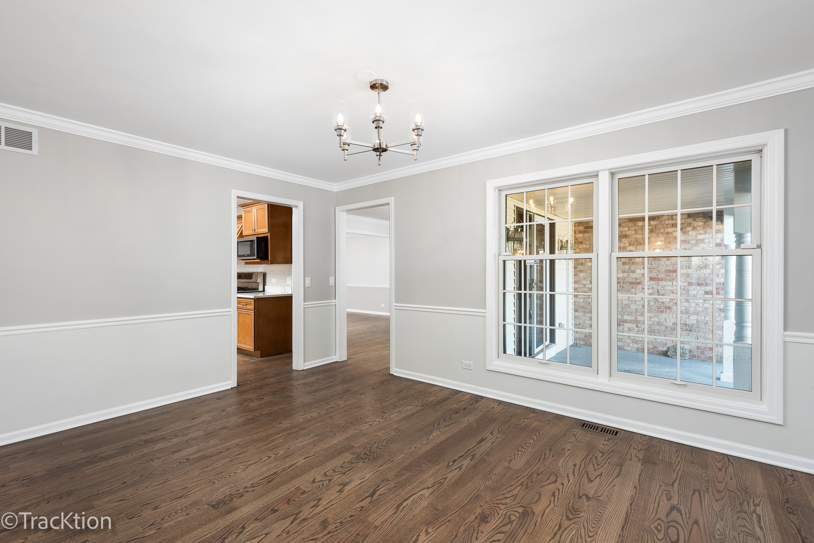 1212 Gartner Road Naperville, IL 60540 - Photo 16 of 32 a view of empty room with wooden floor and windows