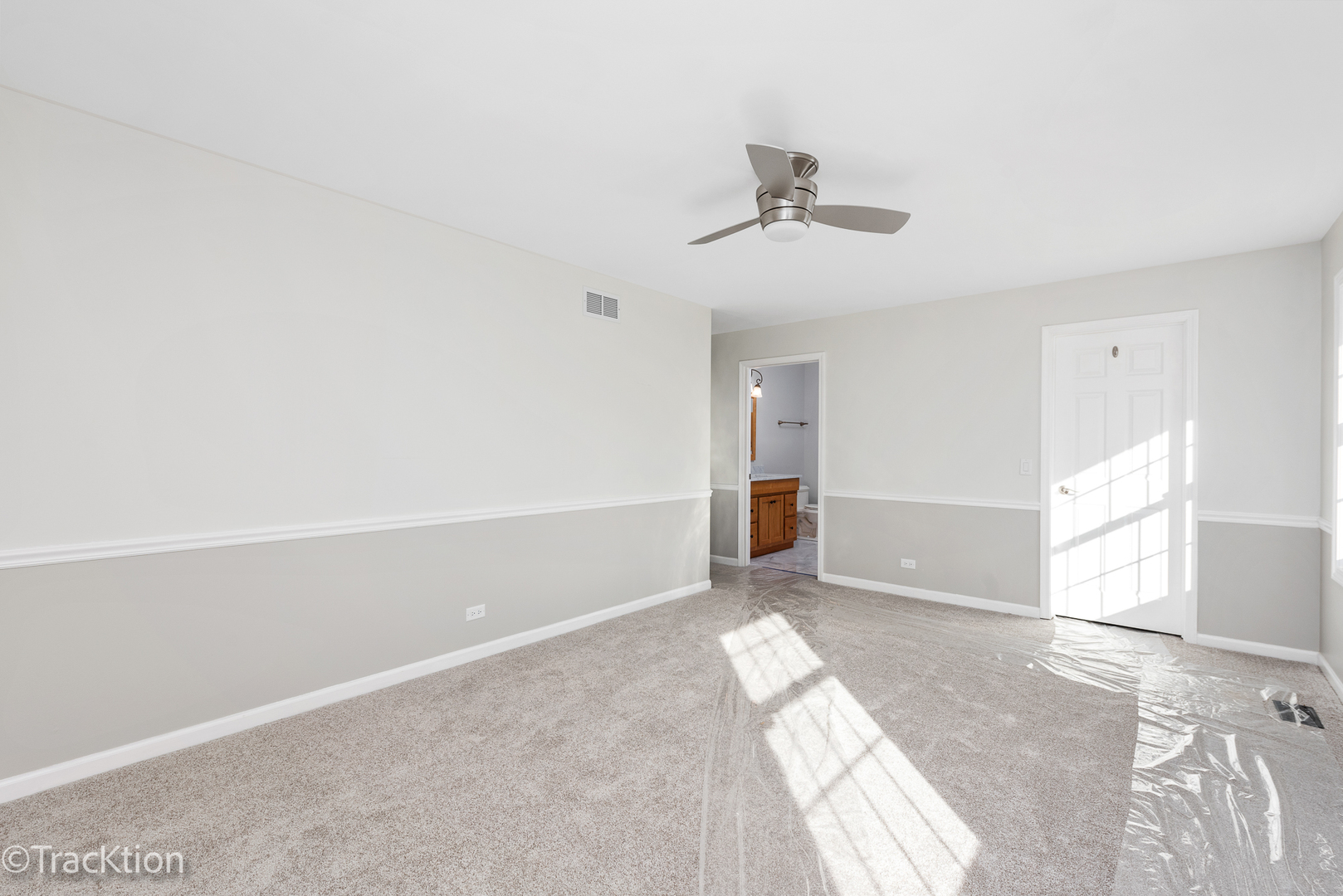 1212 Gartner Road Naperville, IL 60540 - Photo 18 of 32 an empty room with chandelier fan and windows