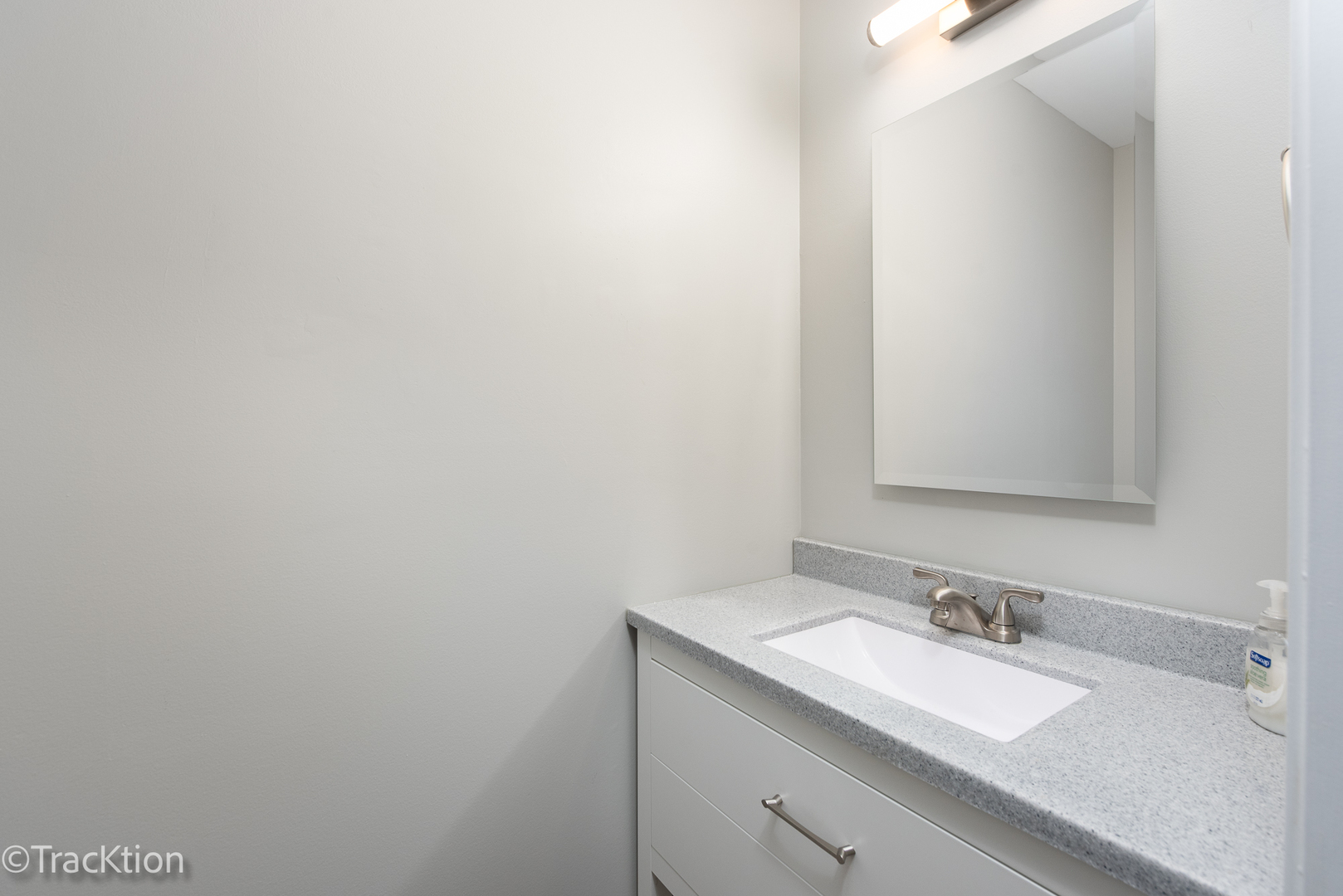 1212 Gartner Road Naperville, IL 60540 - Photo 23 of 32 a bathroom with a sink and a mirror