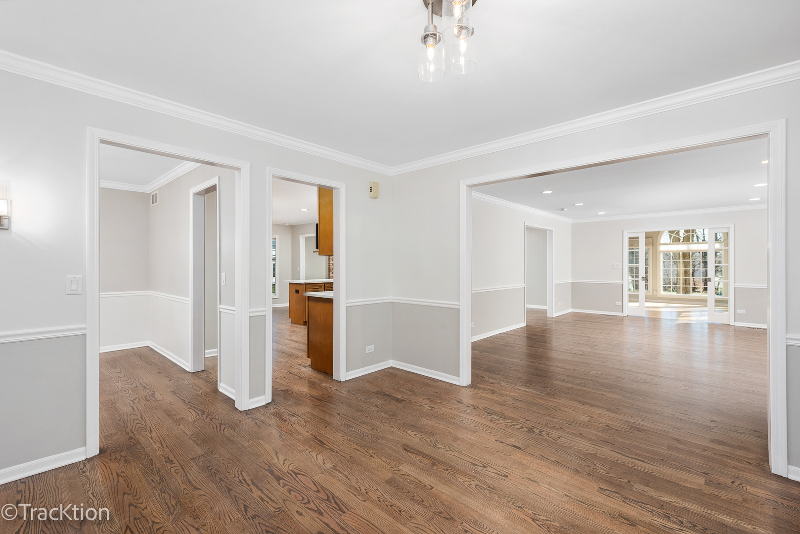 1212 Gartner Road Naperville, IL 60540 - Photo 4 of 32 a view of an empty room with a window and wooden floor