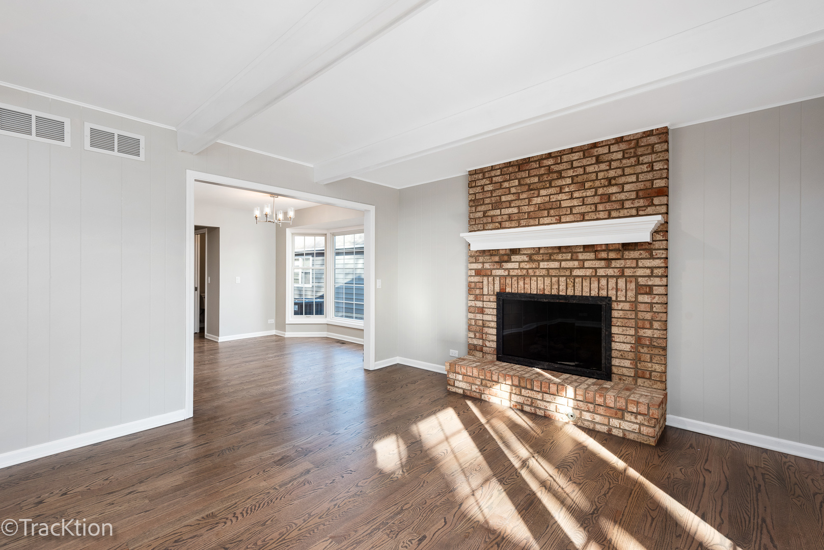 1212 Gartner Road Naperville, IL 60540 - Photo 9 of 32 a view of a livingroom with a fireplace wooden floor and window