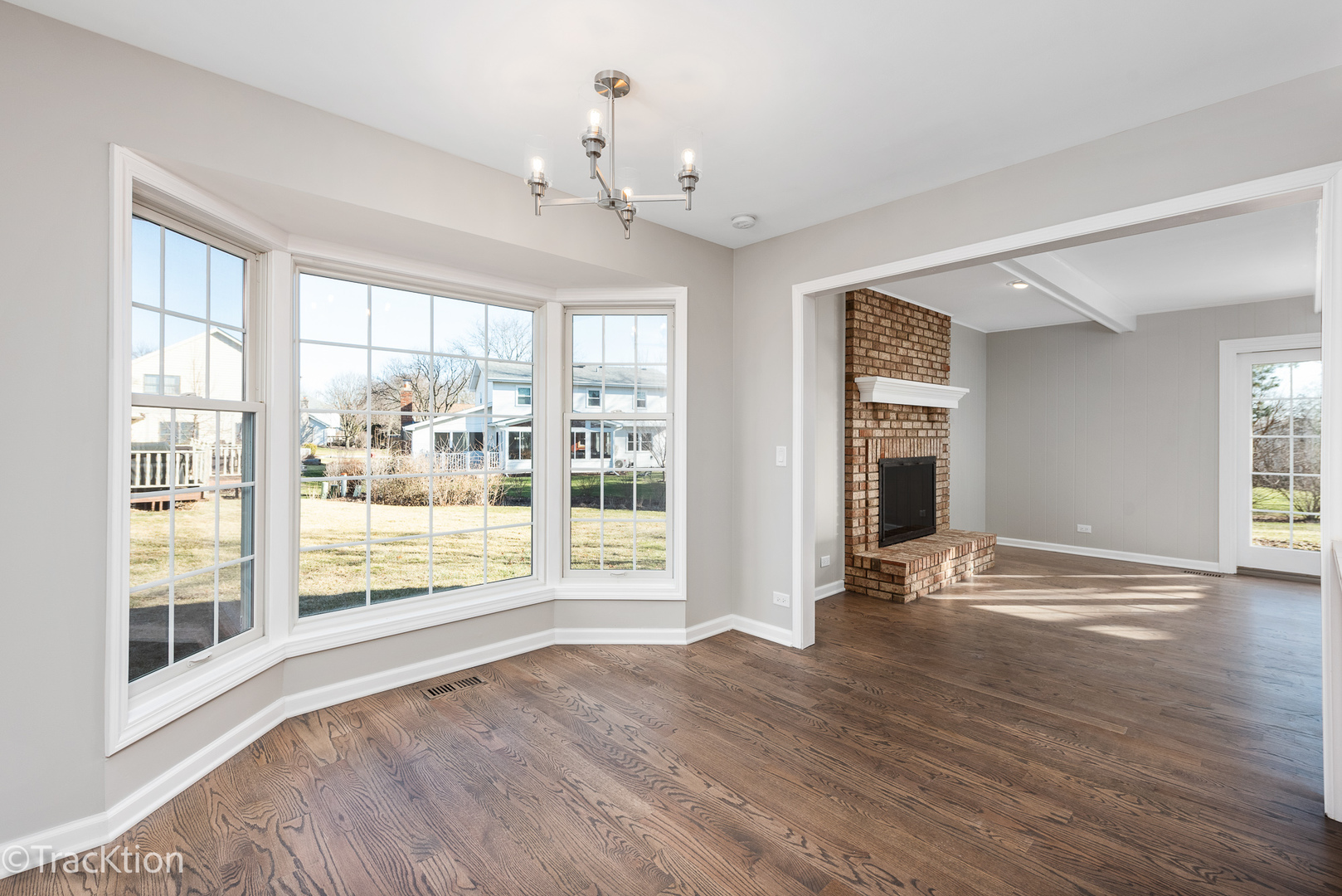 1212 Gartner Road Naperville, IL 60540 - Photo 10 of 32 a view of an empty room with wooden floor and a window