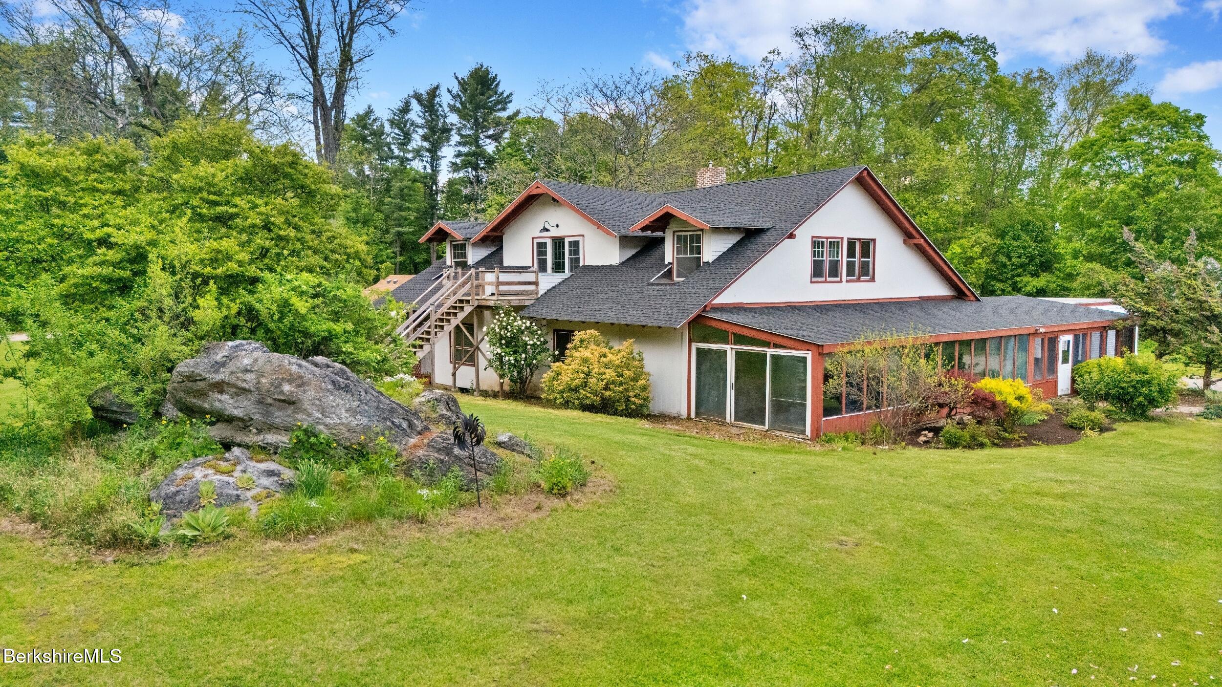 20 East Dugway Road Lenox, MA 01240 - Photo 3 of 84 a front view of a house with yard and green space