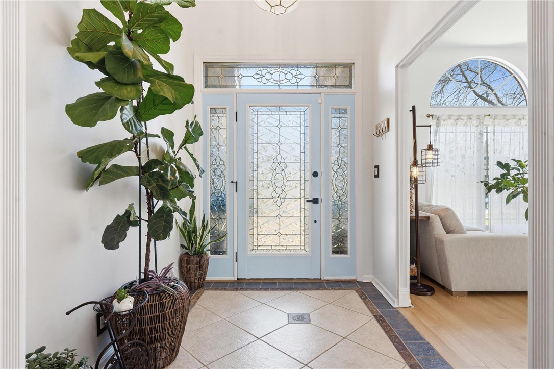8781 Rupp Farm Drive West Chester, OH 45069 - Photo 5 of 48 Step into a luminous entryway featuring an ornate door with decorative glass.