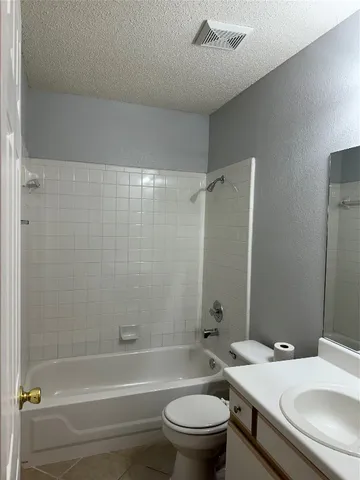 a bathroom with a sink a toilet and a bathtub