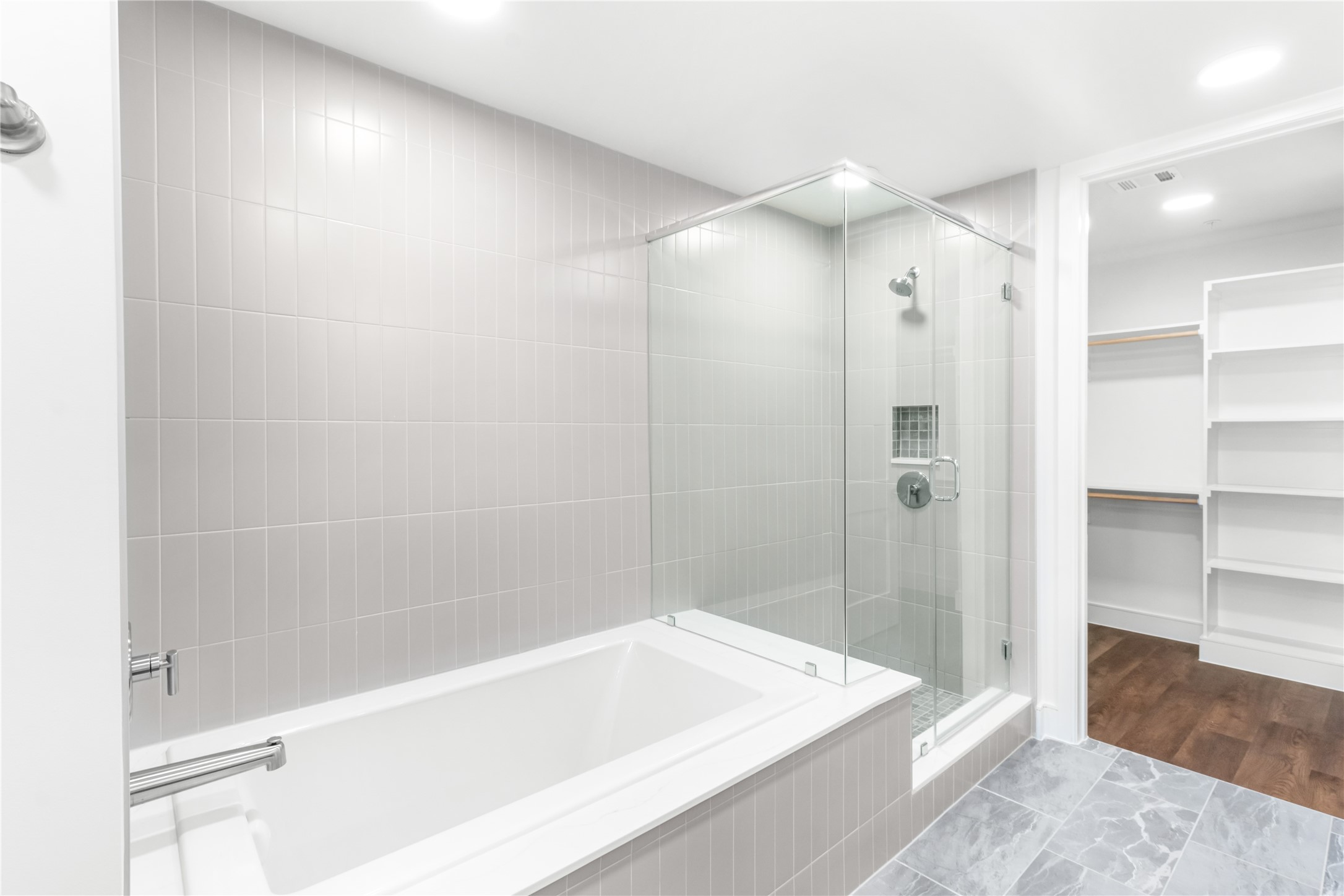 2311 Westheimer Road, Unit 714 Houston, TX 77098 - Photo 15 of 29 a bathroom with a bathtub and a shower