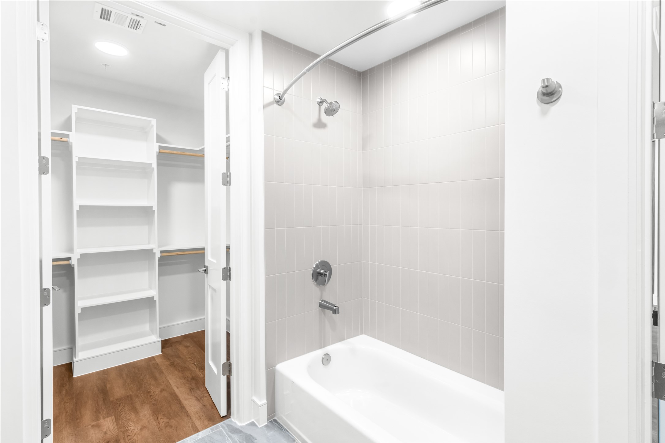 2311 Westheimer Road, Unit 714 Houston, TX 77098 - Photo 20 of 29 a bathroom with a bathtub and a shower