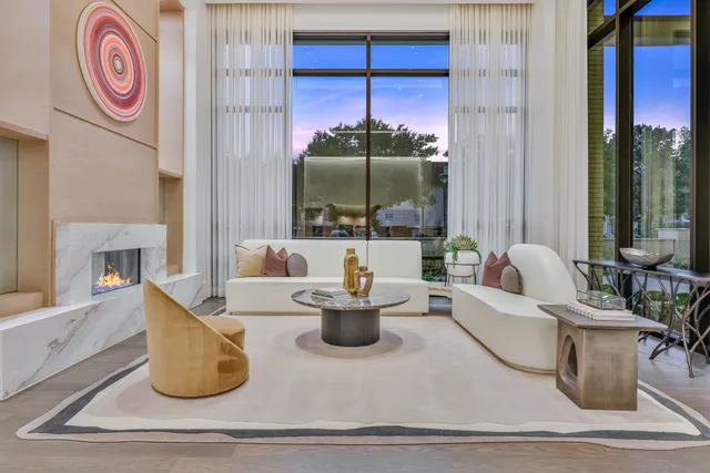 a living room with furniture and a mirror