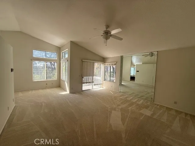 a view of an empty room with a balcony