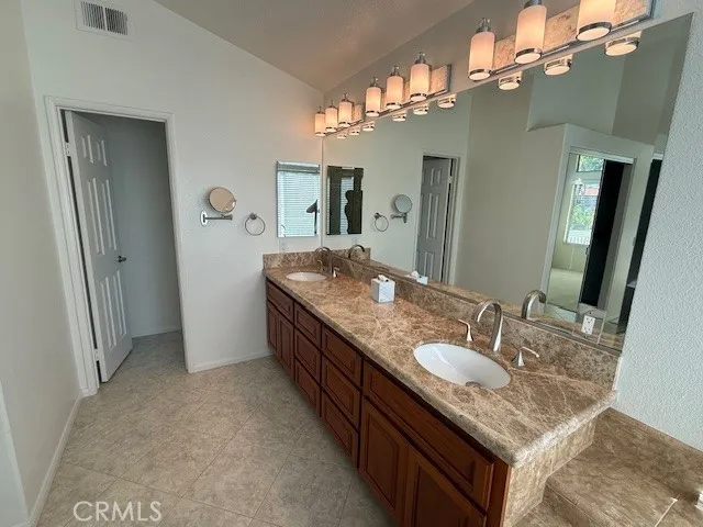 a bathroom with a bath tub and shower