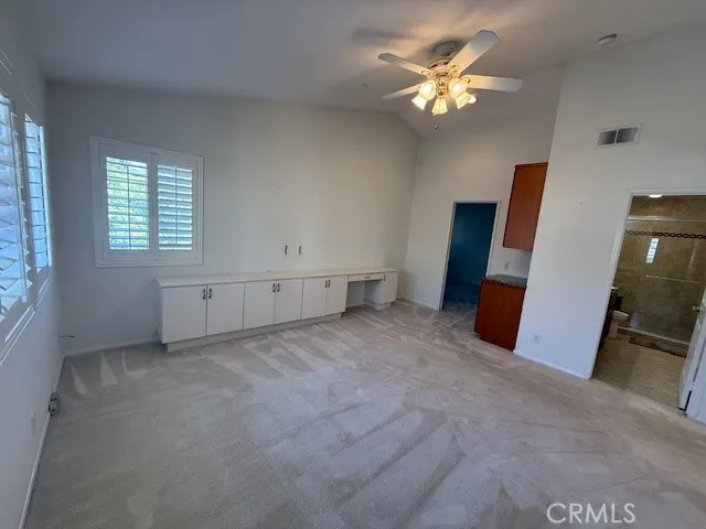 a bathroom with a granite countertop sink a mirror and a bathtub