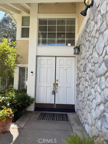 a view of a living room with furniture and a window
