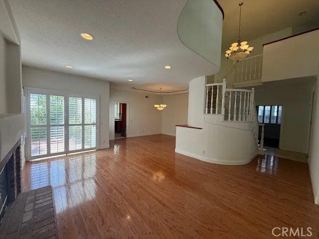 a kitchen with stainless steel appliances kitchen island granite countertop a refrigerator and cabinets