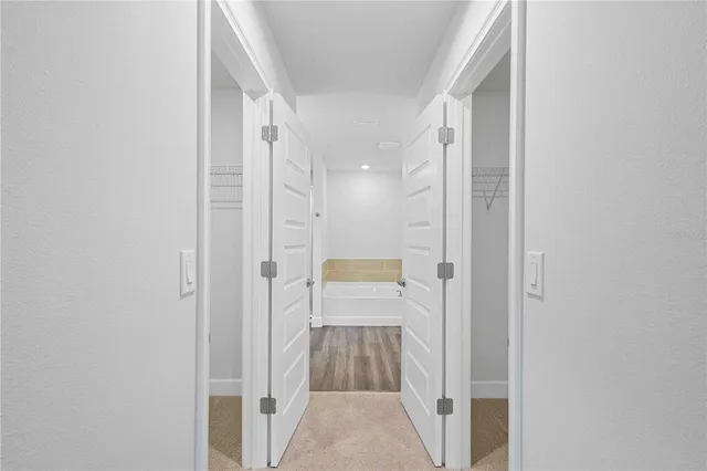 a en suite bathroom with a granite countertop sink and a mirror