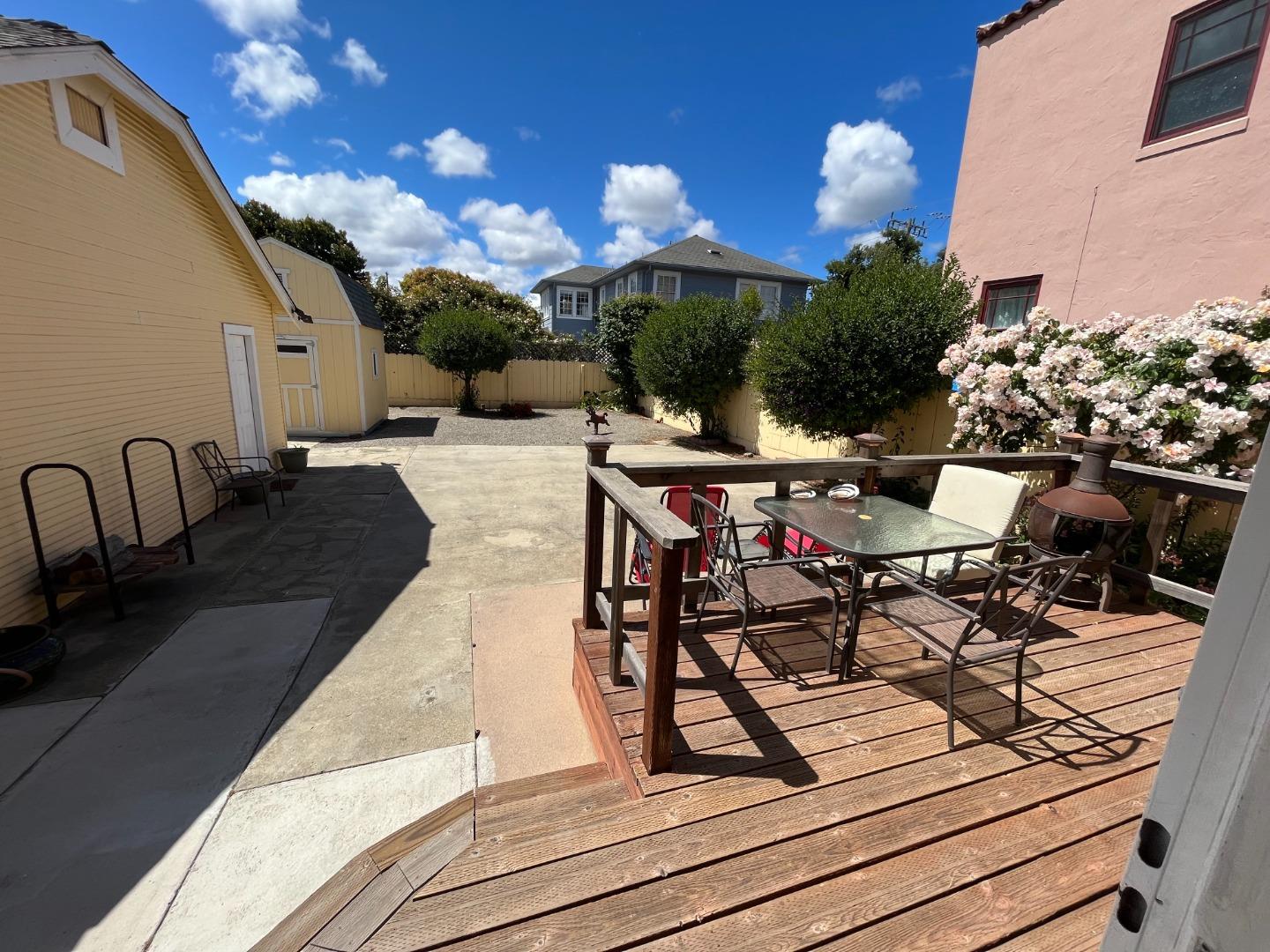 106 Maple Street Salinas, CA 93901 - Photo 14 of 22 a view of a patio with table and chairs potted plants with wooden floor