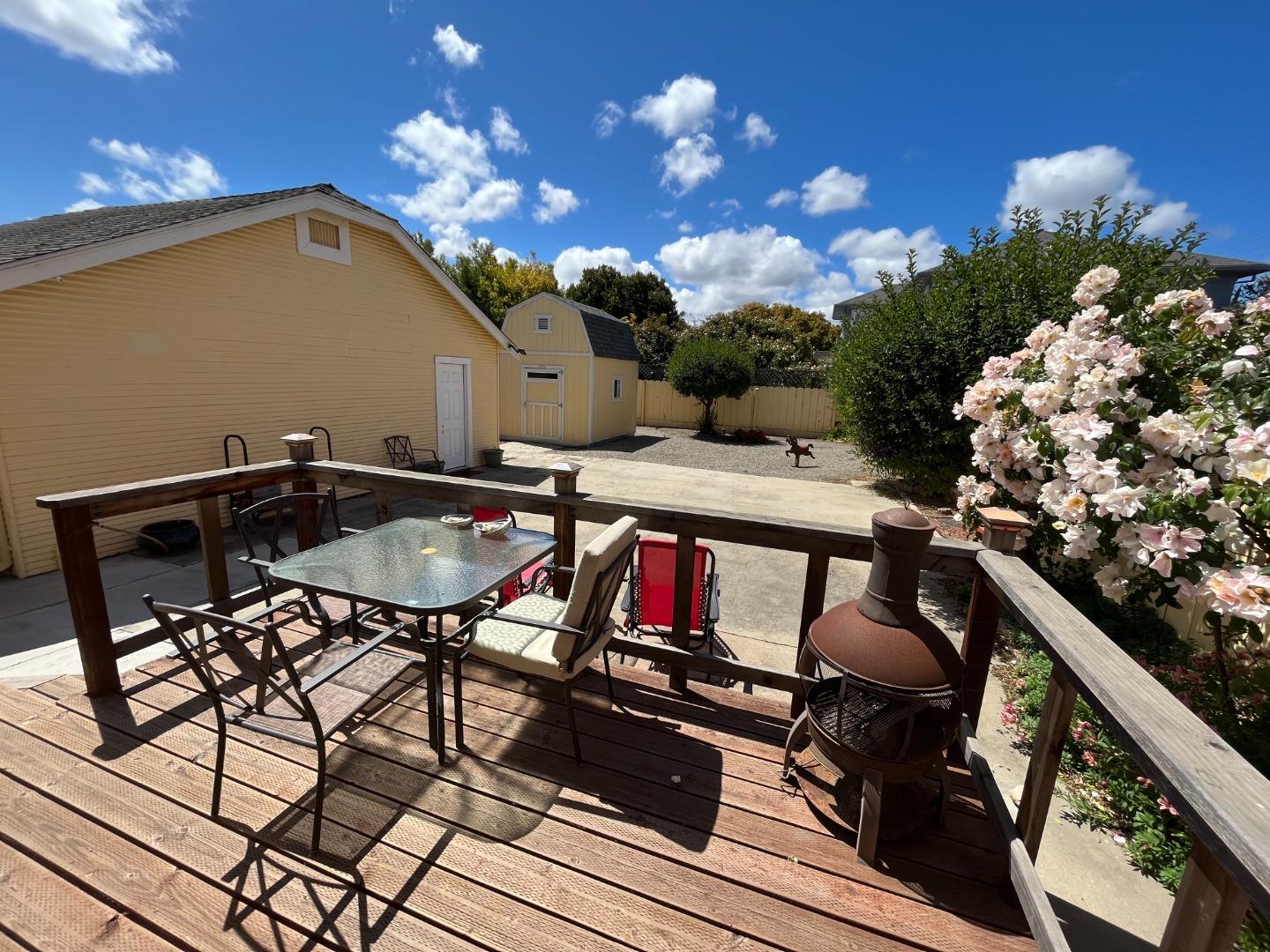 106 Maple Street Salinas, CA 93901 - Photo 15 of 22 a roof deck with table and chairs and potted plants