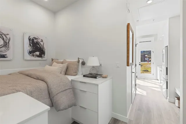 a bedroom with a bed and a table