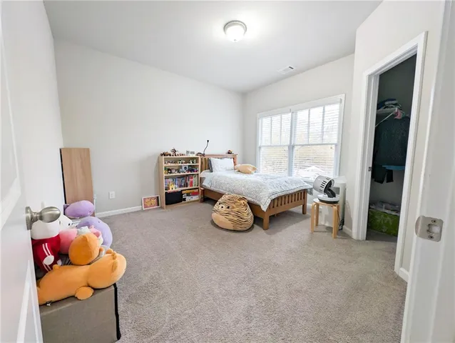 a bedroom with furniture and a bed