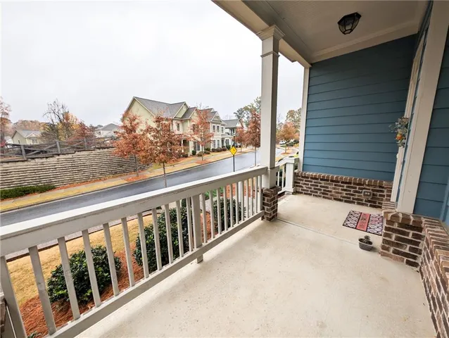 a view of a balcony with furniture