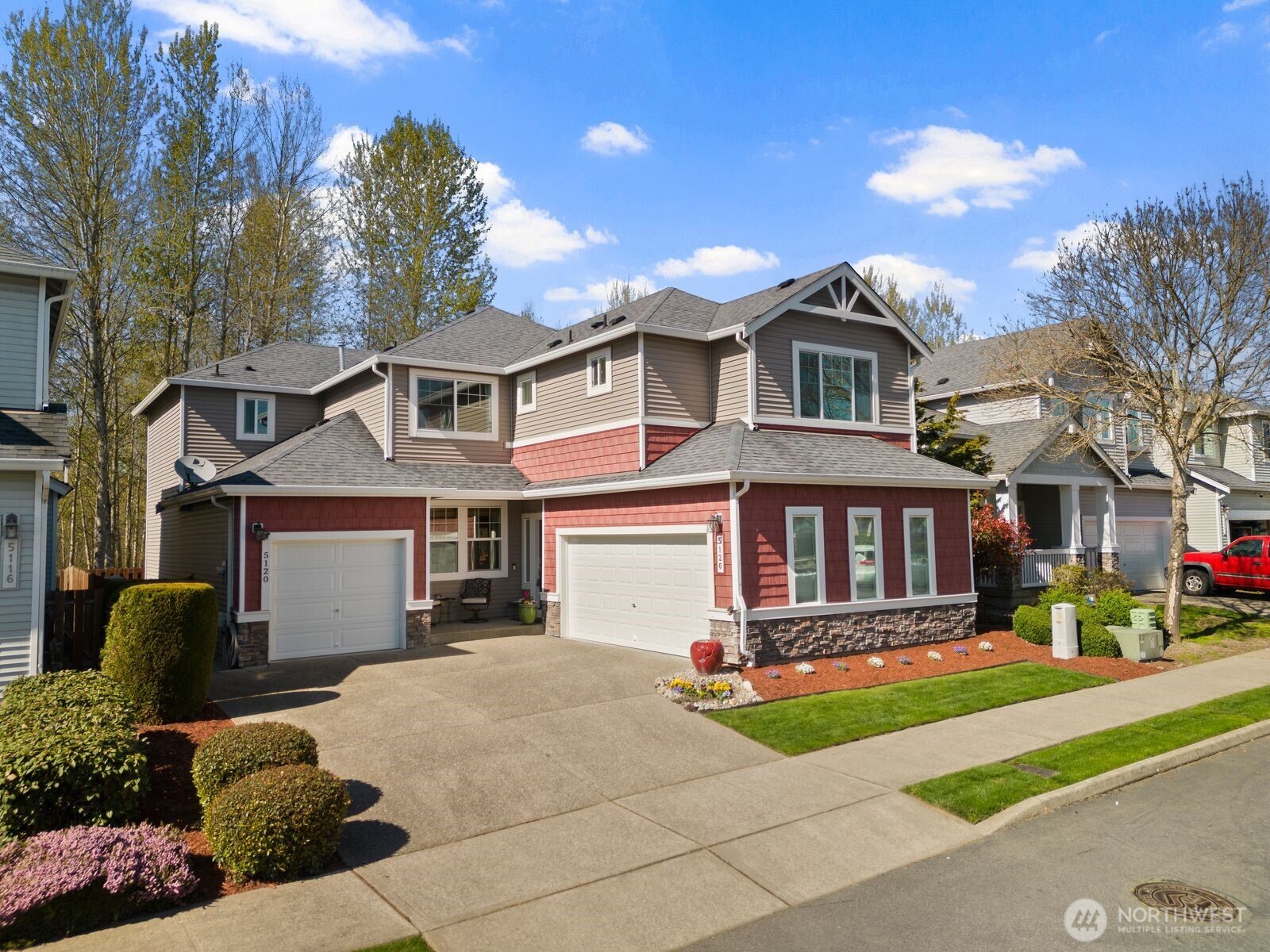 5120 South 214th Way, Unit 10 Kent, WA 98032 - Photo 1 of 39 a front view of a house with yard and green space