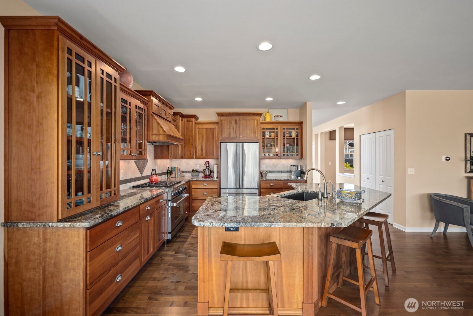 5120 South 214th Way, Unit 10 Kent, WA 98032 - Photo 11 of 39 a kitchen with stainless steel appliances granite countertop a refrigerator and a stove top oven