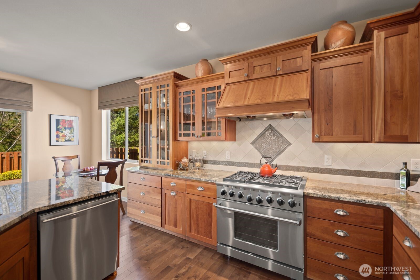 5120 South 214th Way, Unit 10 Kent, WA 98032 - Photo 12 of 39 a kitchen with stainless steel appliances granite countertop a stove and a sink