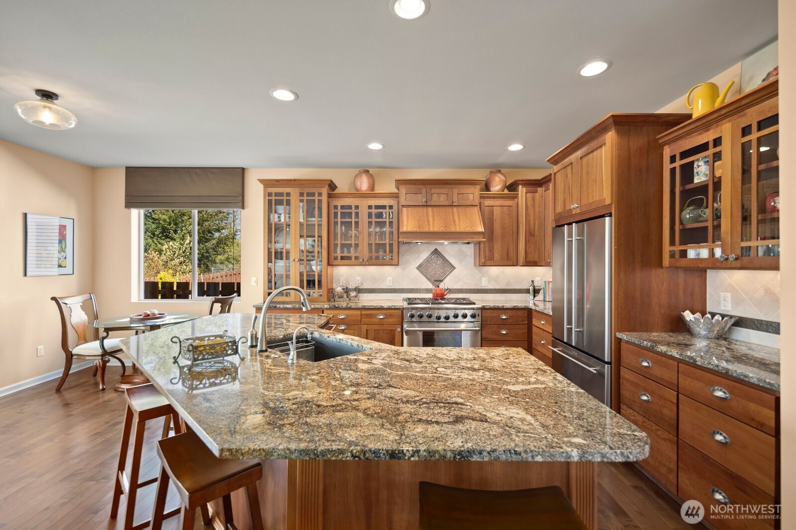 5120 South 214th Way, Unit 10 Kent, WA 98032 - Photo 14 of 39 a large kitchen with kitchen island a large window in it