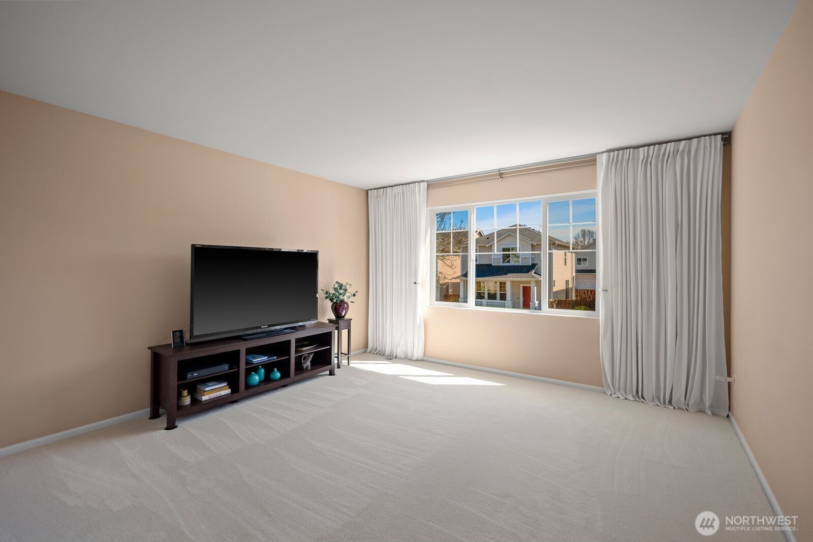 5120 South 214th Way, Unit 10 Kent, WA 98032 - Photo 18 of 39 a living room with furniture and a flat screen tv