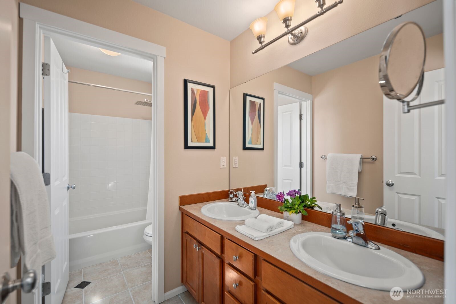 5120 South 214th Way, Unit 10 Kent, WA 98032 - Photo 19 of 39 a bathroom with a sink and a mirror