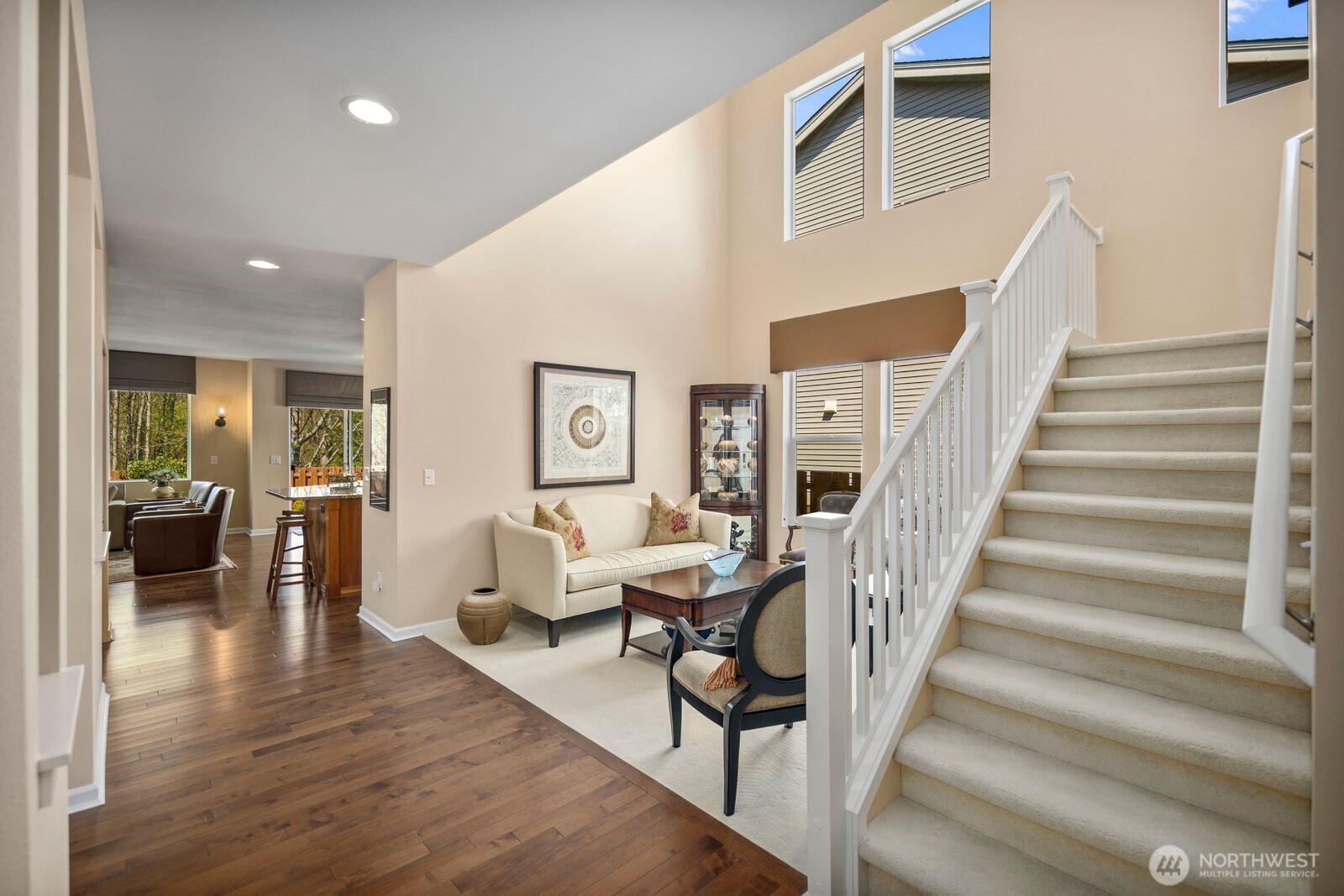 5120 South 214th Way, Unit 10 Kent, WA 98032 - Photo 2 of 39 a view of a livingroom with furniture and hardwood floor