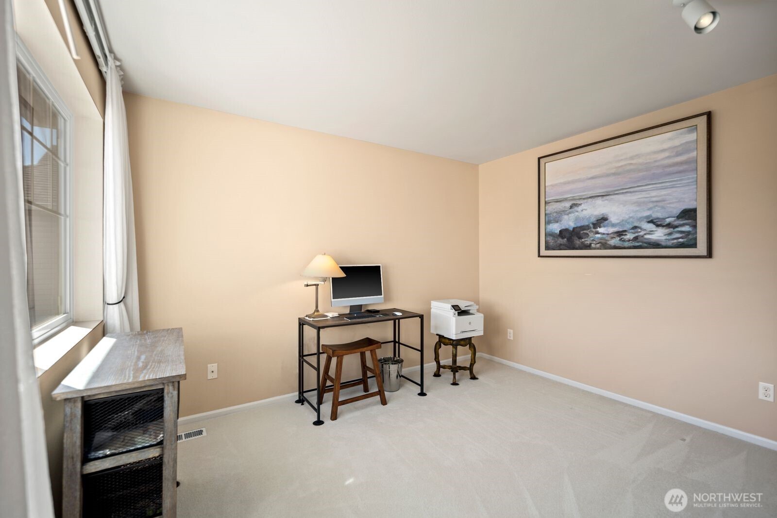5120 South 214th Way, Unit 10 Kent, WA 98032 - Photo 21 of 39 a view of a workspace with furniture and a window