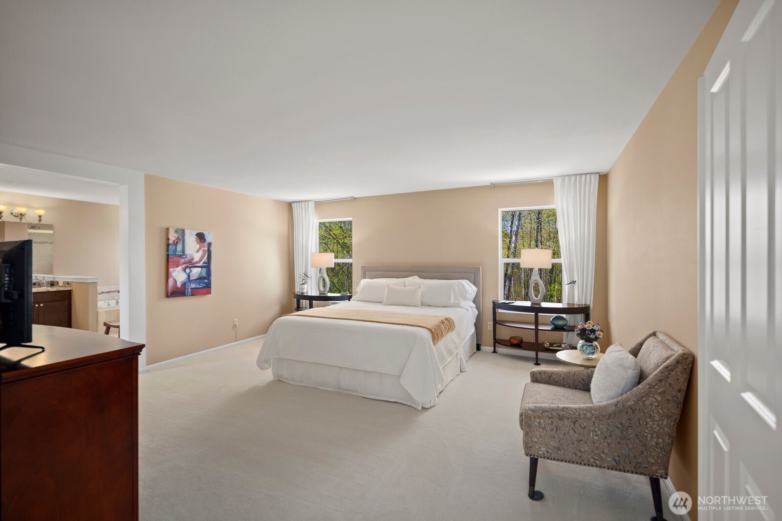 5120 South 214th Way, Unit 10 Kent, WA 98032 - Photo 22 of 39 a spacious bedroom with a bed and a couch