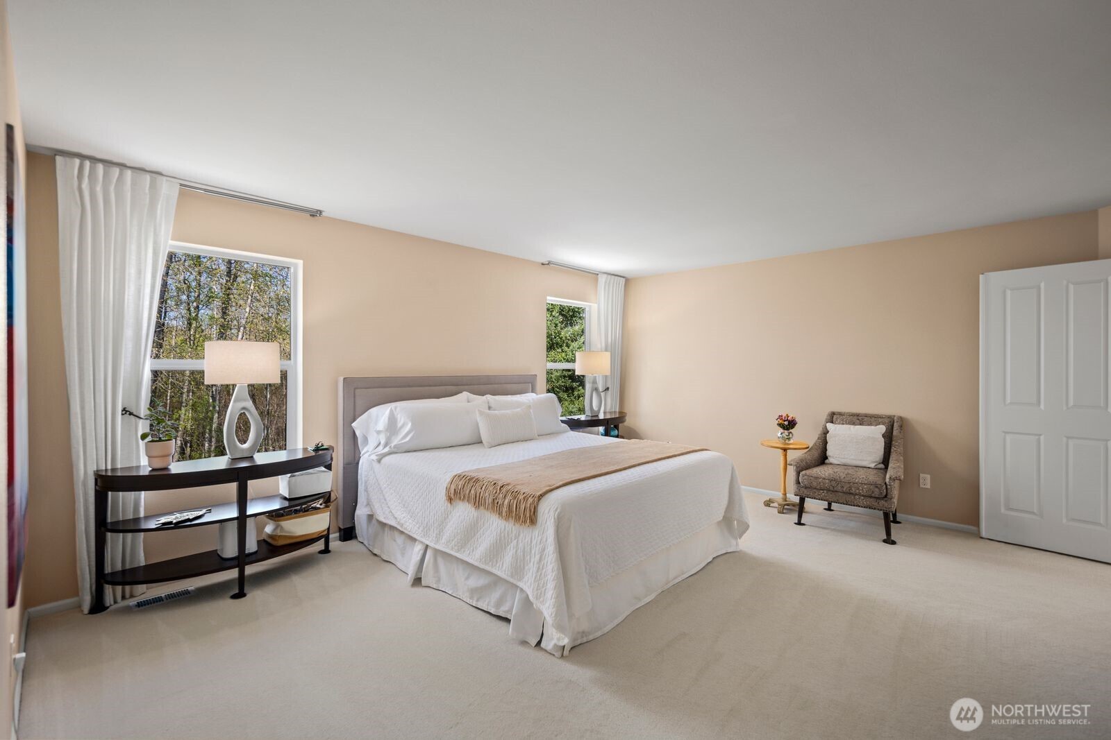 5120 South 214th Way, Unit 10 Kent, WA 98032 - Photo 24 of 39 a bedroom with a bed and a couch