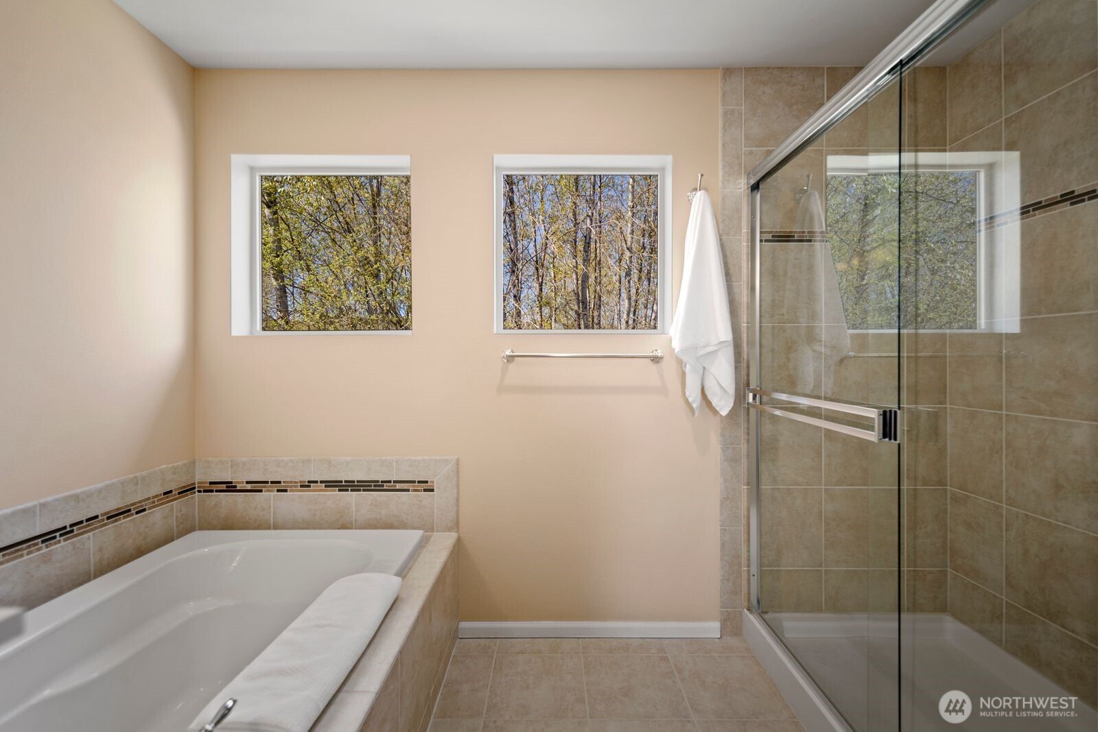 5120 South 214th Way, Unit 10 Kent, WA 98032 - Photo 28 of 39 a bathroom with a tub and shower