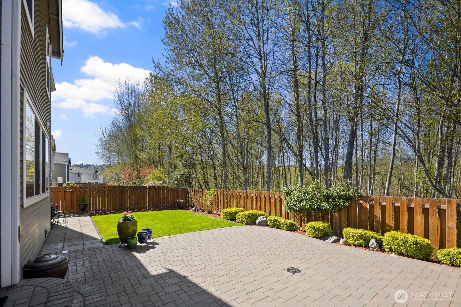 5120 South 214th Way, Unit 10 Kent, WA 98032 - Photo 31 of 39 a view of a park with a bench and trees