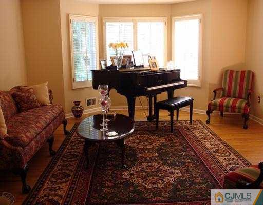 27 Hillsdale Road Edison, NJ 08820 - Photo 2 of 10 a living room with furniture and a floor to ceiling window