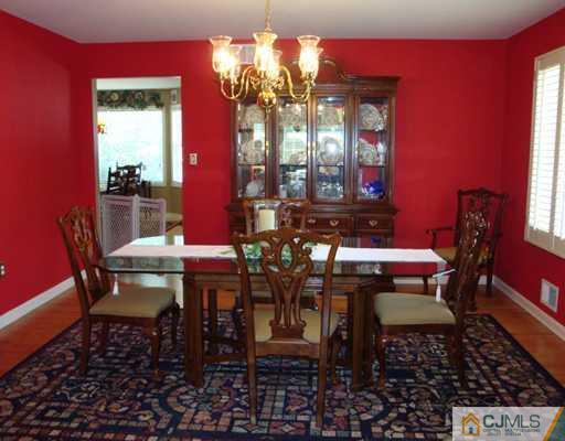 27 Hillsdale Road Edison, NJ 08820 - Photo 3 of 10 a view of a dining room with furniture and chandelier