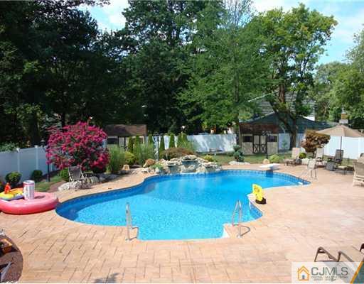 27 Hillsdale Road Edison, NJ 08820 - Photo 10 of 10 a view of a swimming pool with a patio