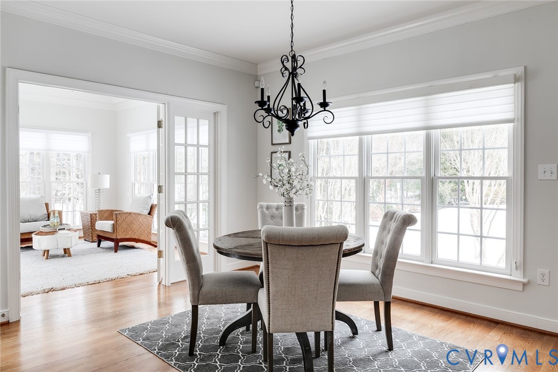 507 Hunt Field Road Manakin-Sabot, VA 23103 - Photo 15 of 43 a view of a dining room with furniture wooden floor and a chandelier