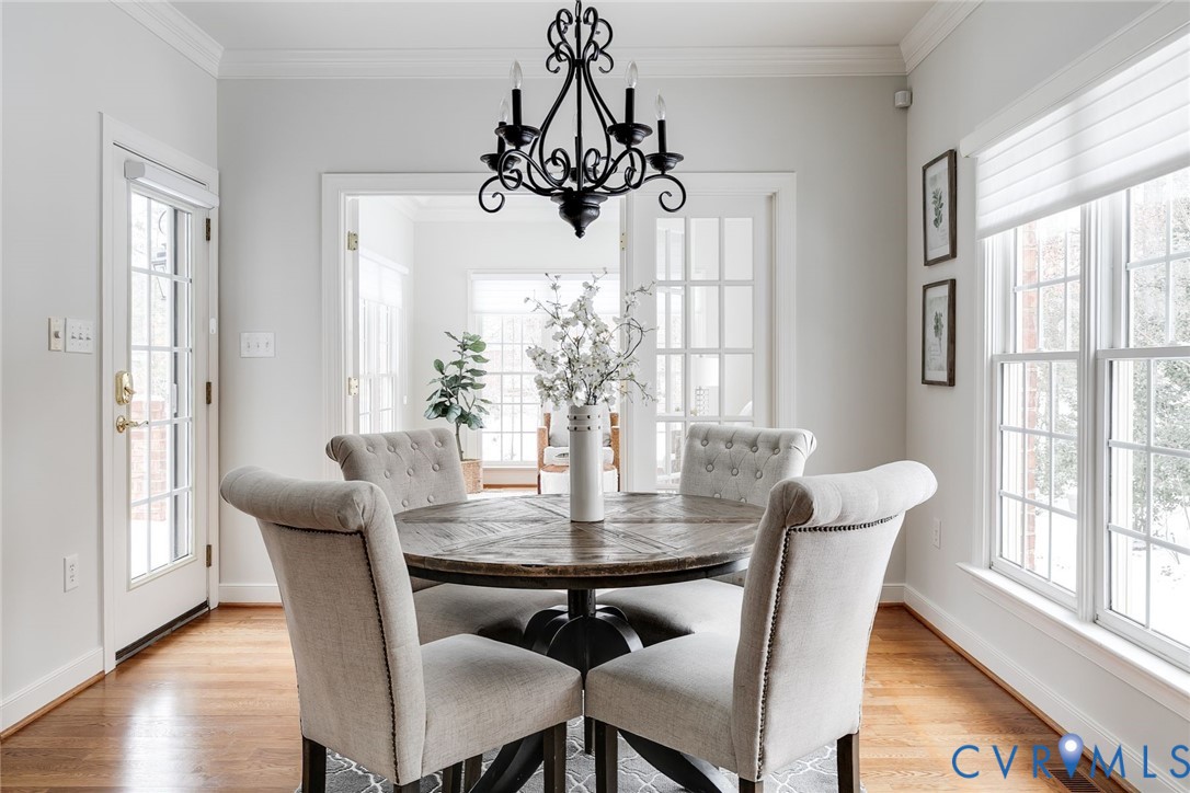 507 Hunt Field Road Manakin-Sabot, VA 23103 - Photo 18 of 43 a view of a dining room with furniture wooden floor and chandelier